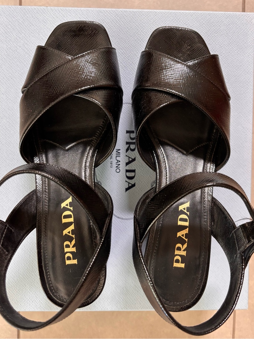 PRADA Black Calzature Donna textured patent leather platforms.